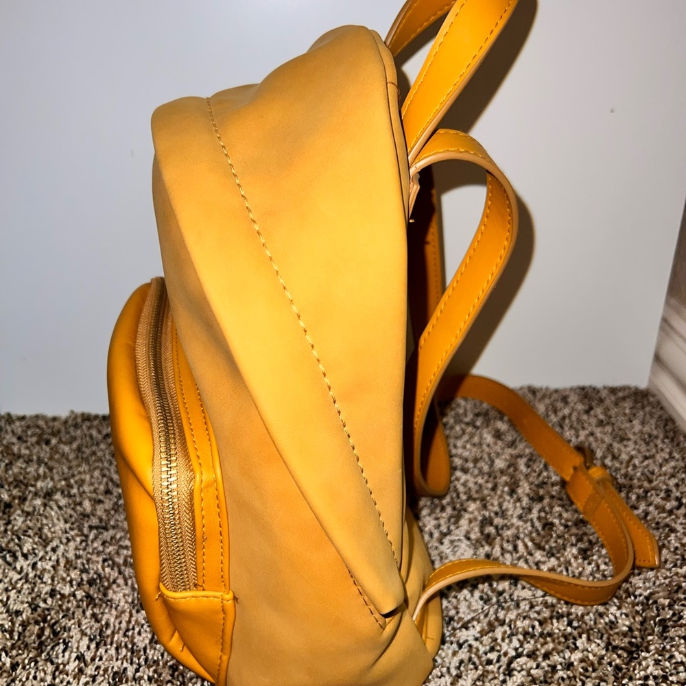 Universal Treads goods Co. Mustard backpack.
